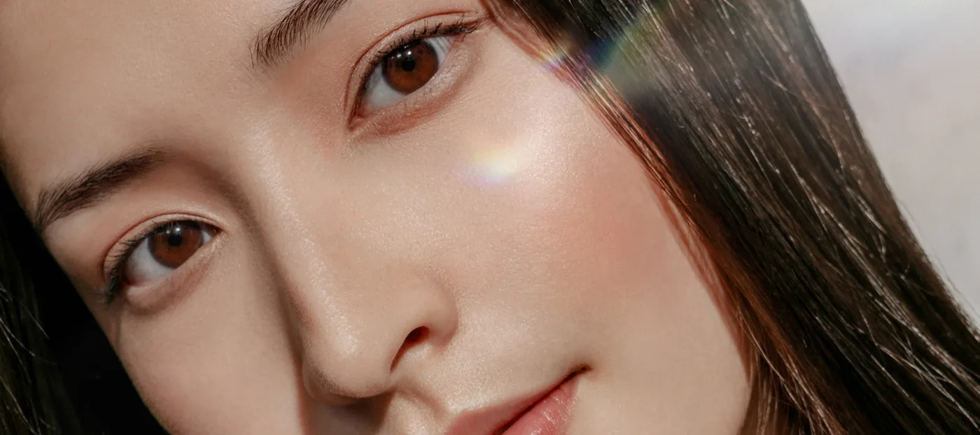 A face in soft prismatic light
